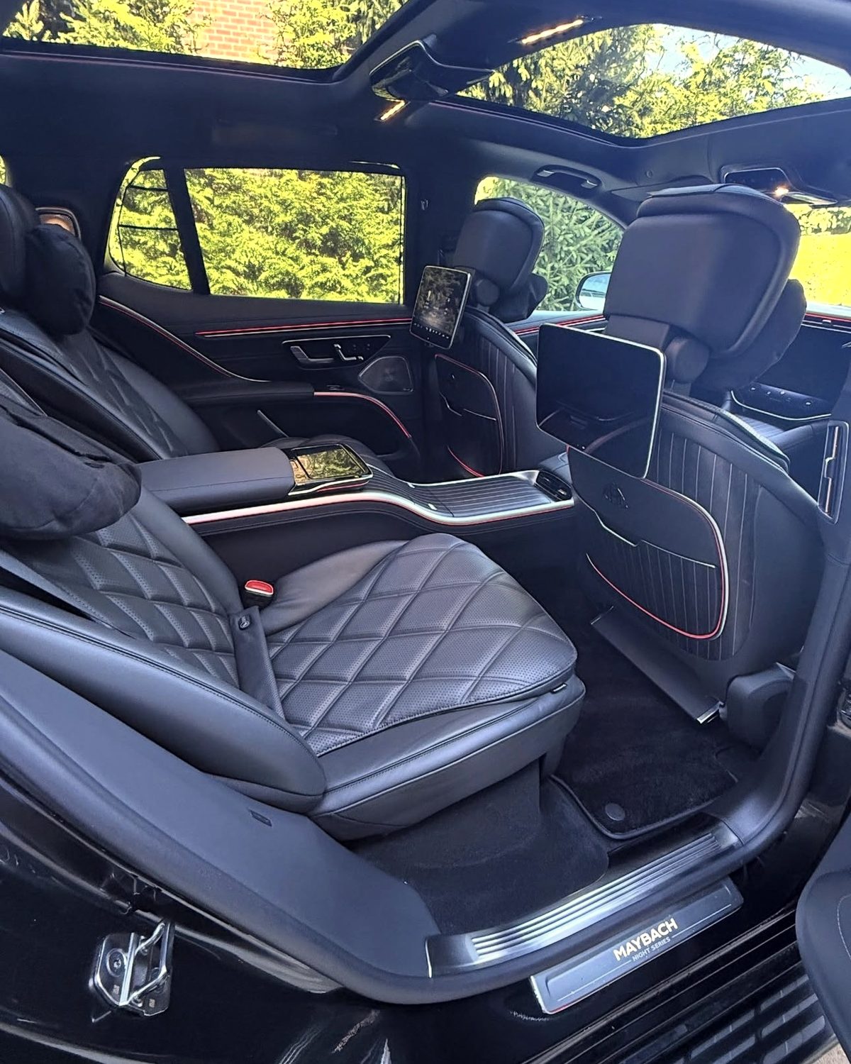 Detailed Maybach rear cabin — quilted leather, clean glass and dressed trim