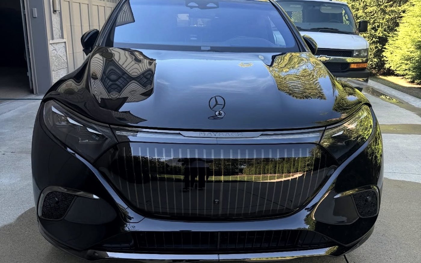 Head-on view of a Mercedes-Maybach EQS, the grille and bonnet polished to a mirror